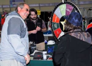 Customers spinning the wheel for prizes at Alpine Shop O'Fallon's Grand Opening Celebration on Friday, March 22.